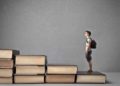 Person standing on books