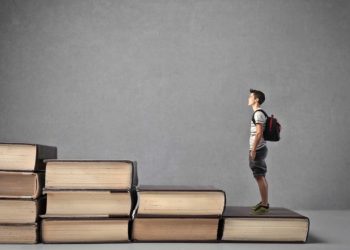 Person standing on books