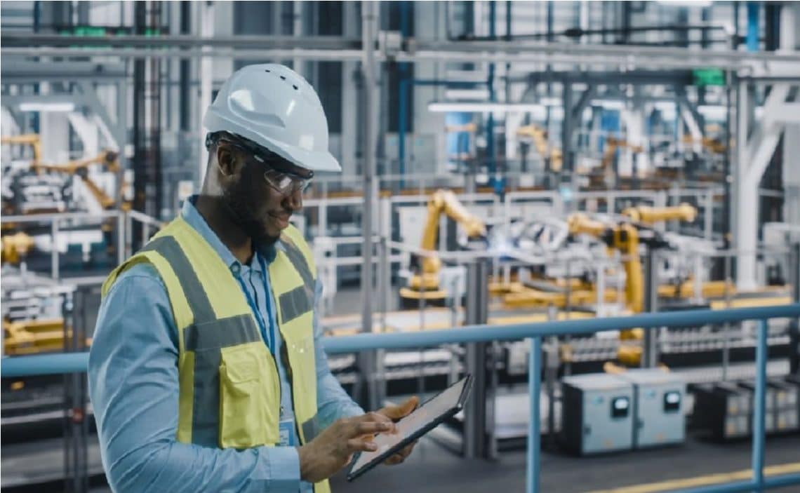 man working in industrial machinery