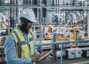 man working in industrial machinery