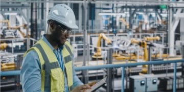 man working in industrial machinery