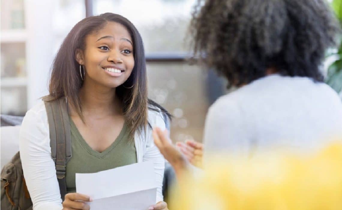 girl holding a recommendation letter for scholarship