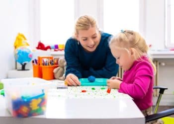 Occupational therapists treating a children