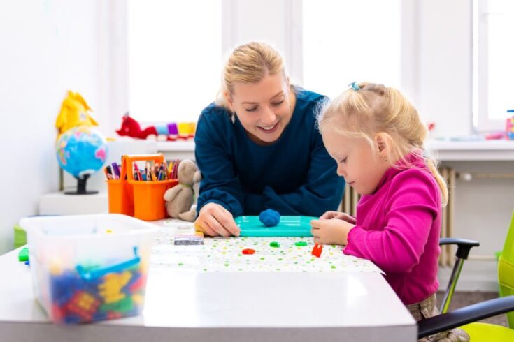 Occupational therapists treating a children