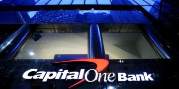 When does Capital One report to the credit bureau?