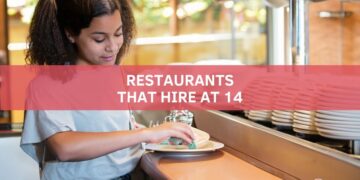 Teenager washing the dishes at a restaurant