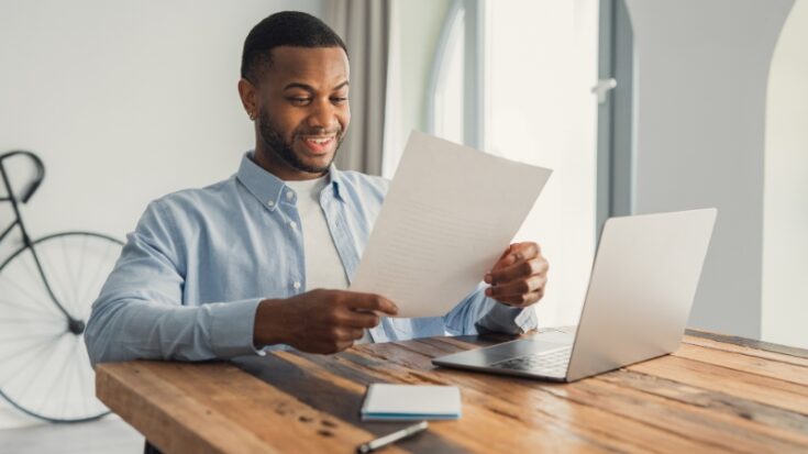 Man reviews a document with relief after realizing his wrong major does not limit his future